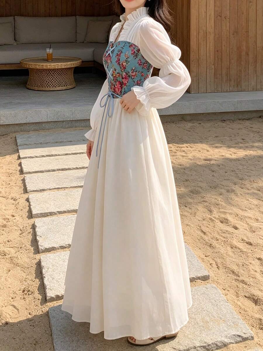 Side view of blue floral corset maxi dress with bishop sleeves