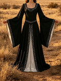 Front view of black Renaissance maxi dress with white underlayer and bell sleeves