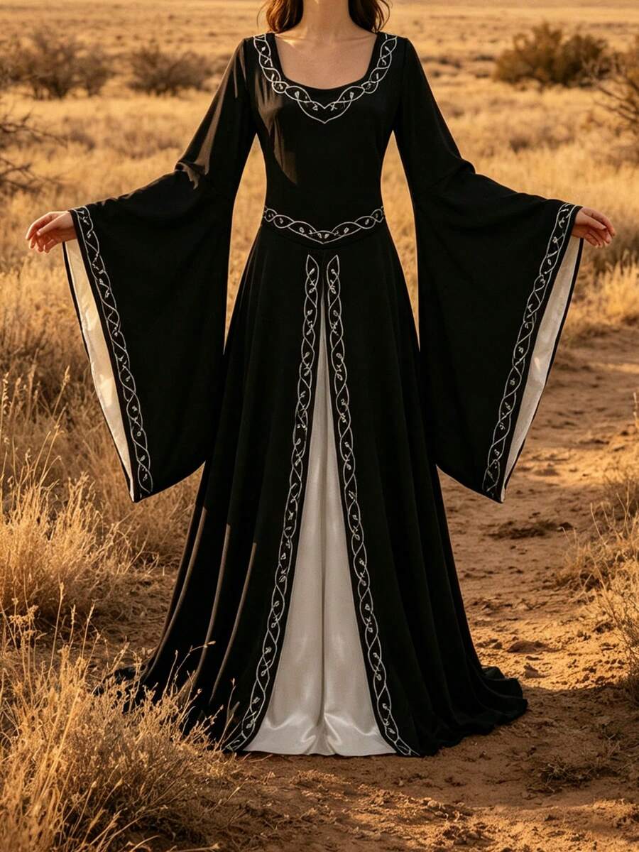 Front view of black Renaissance maxi dress with white underlayer and bell sleeves