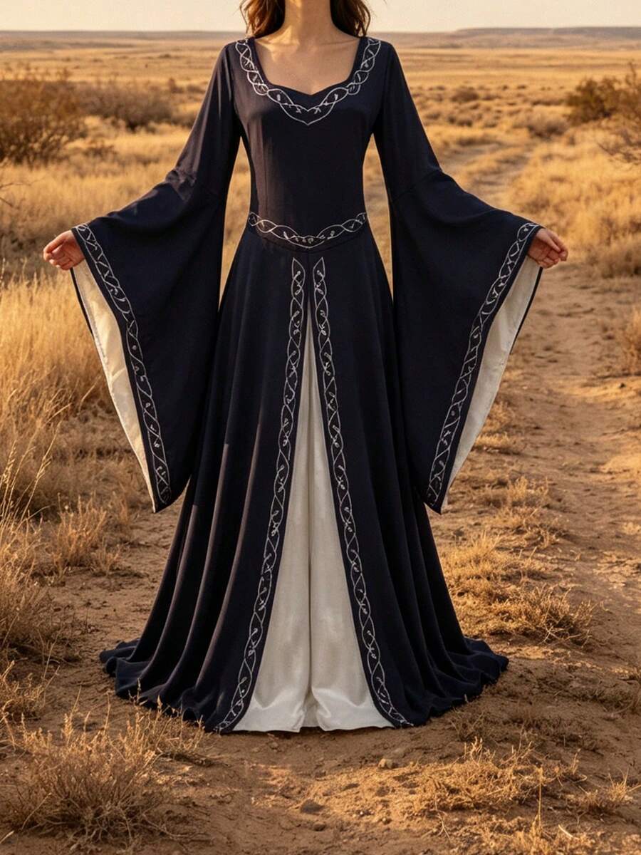 Front view of navy blue Renaissance maxi gown with bell sleeves and white underlayer