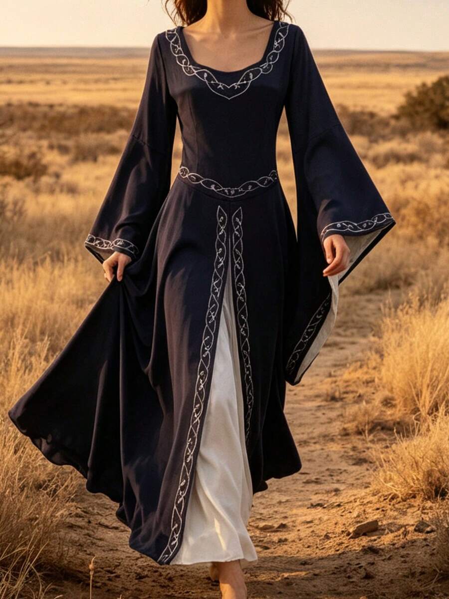Angled front view of navy Celtic-inspired medieval dress with embroidered-style trim