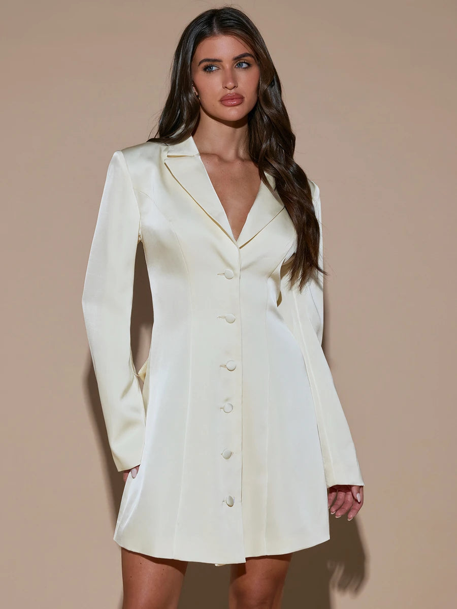 Rear view of ivory satin-look blazer mini dress with open back and large tied bow