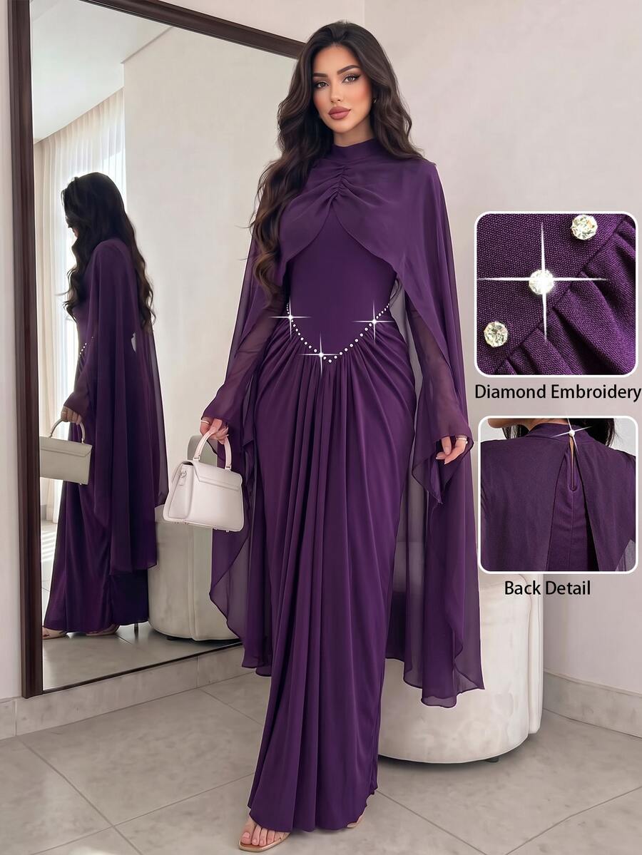 Front view of purple floor-length cape-sleeve gown with crystal waist embroidery and high neckline