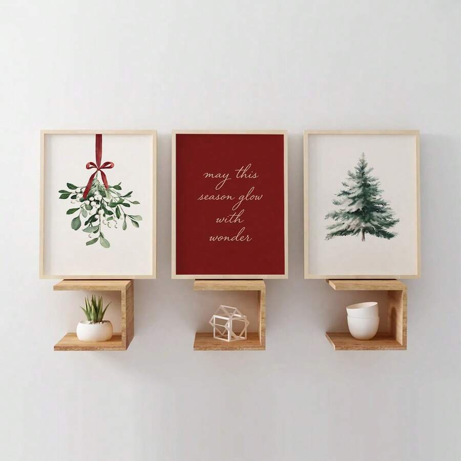 Three framed Christmas canvas prints with mistletoe, holiday quote and evergreen above a decorated mantel
