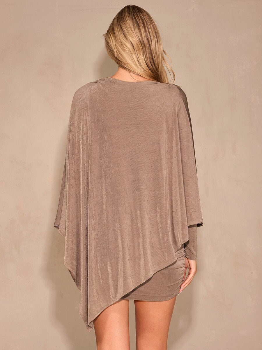 Back view of mocha brown knit bodycon mini dress with long draped cape sleeve