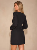 Back view of black long sleeve bodycon mini dress with centered upper zipper
