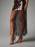 Detail of long coffee-brown fringe strands beneath the sequin dress panel