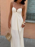 Close front view of beige keyhole gathered bodice maxi dress outdoors