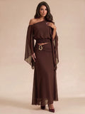 Side view of brown chiffon crop top and high-rise maxi skirt with gold buckle