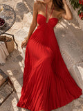 White pleated halter maxi dress with open side cutouts, front view
