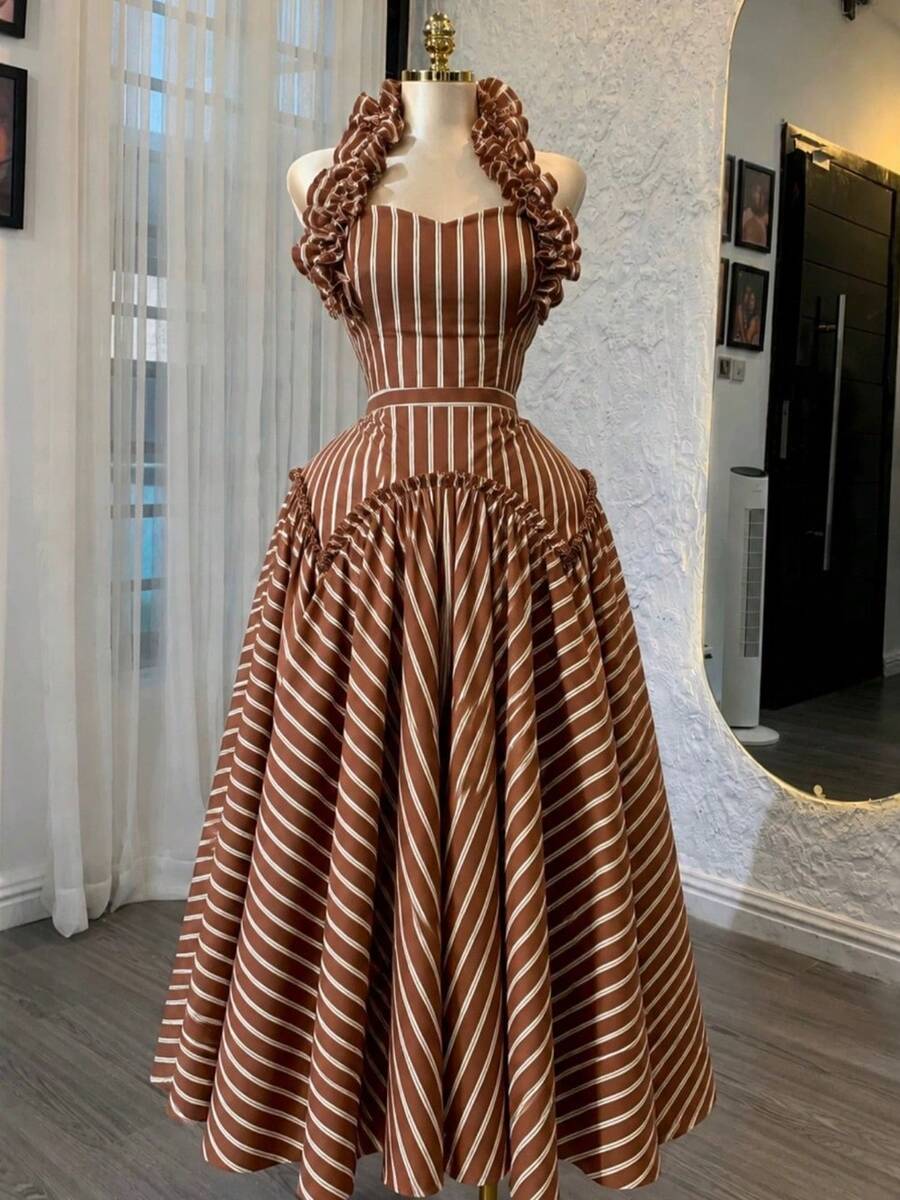 Full front view of brown-and-cream striped swing dress with ruffled shoulder straps and full flared skirt
