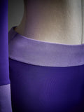 Close-up of lavender colorblock waistband and purple mini skirt from three-piece costume set