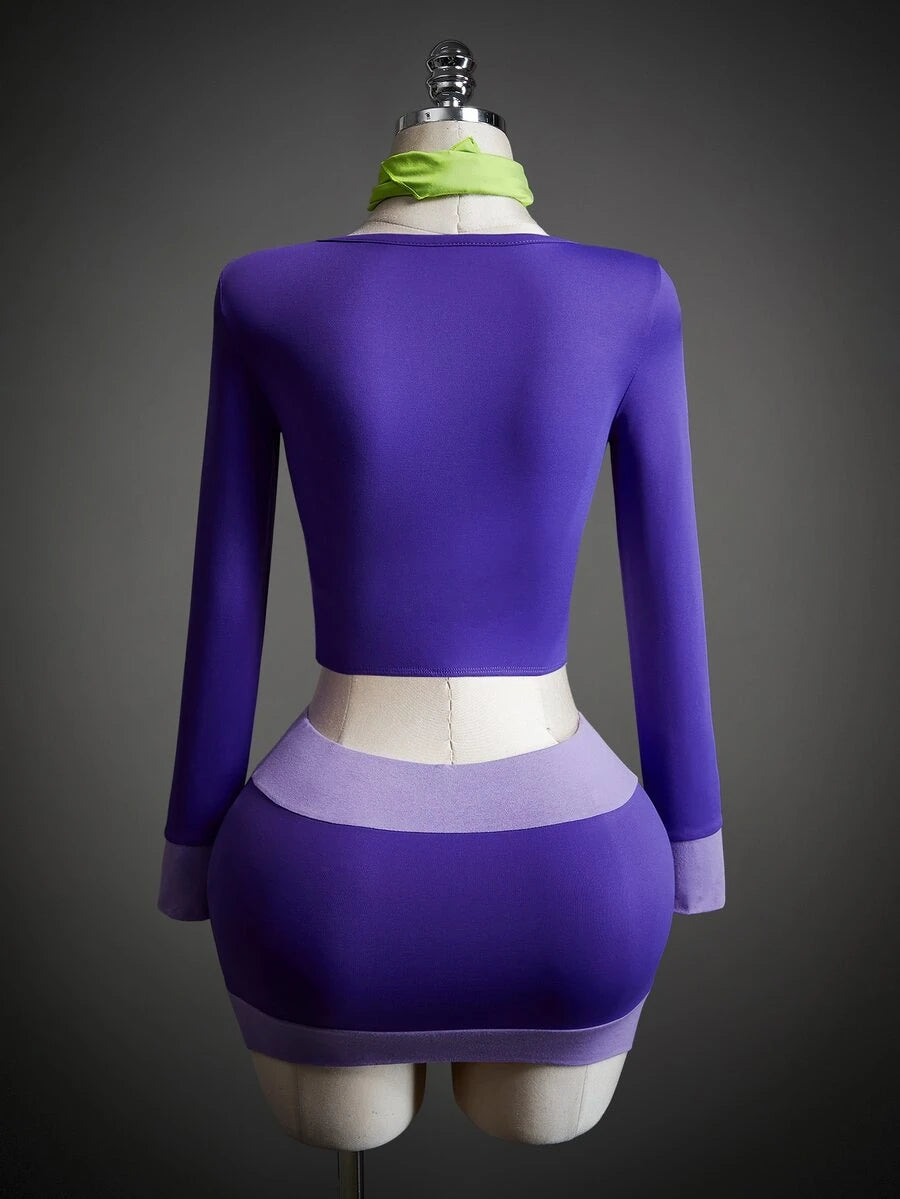 Front view of purple long-sleeve ruched crop top and mini skirt Halloween costume set with green scarf