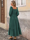 Back view of dark green long sleeve midi dress with smocked square back
