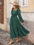 Side front view of dark green ruffle A-line midi dress with flounce hem