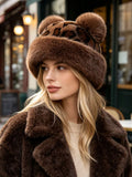 Three-quarter view of dark brown leopard-print plush bucket hat with matching furry brim and ears