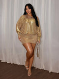 Full-length view of reflective gold party mini dress with fitted skirt, strappy heels and metallic handbag