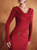 Close-up of the red knitted dress cowl neckline, long sleeve, gathered waist and gold-tone ring detail.