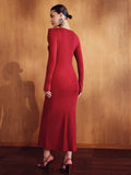 Rear three-quarter view of the fitted deep red long-sleeve dress showing its smooth back and slim skirt.