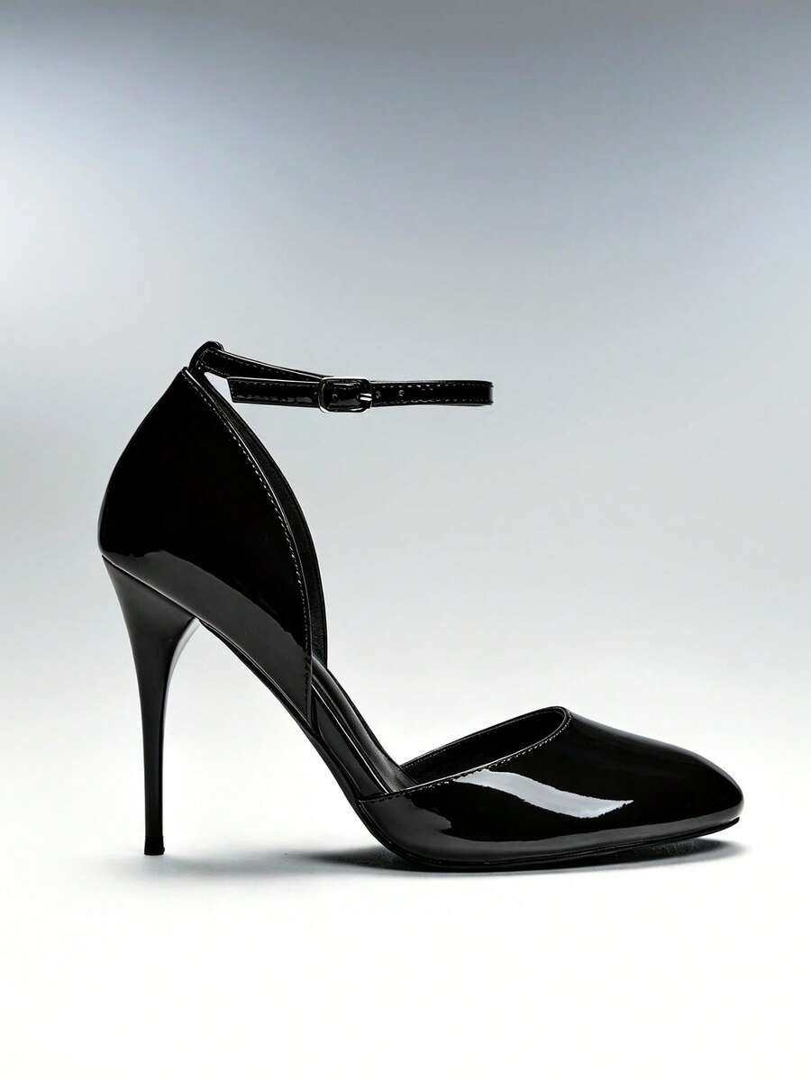 Side view of black glossy ankle-strap stiletto pump