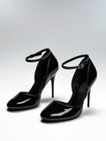 Pair of black patent closed-toe stiletto pumps with ankle buckles