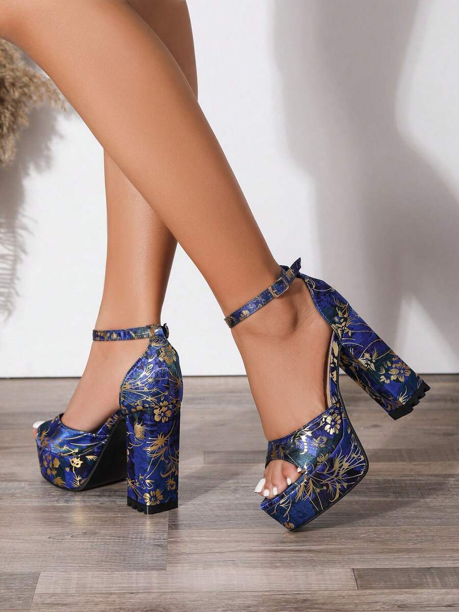 Side view of navy blue floral open-toe platform block heels