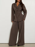 Full-length front view of belted brown blazer suit with flowing wide trousers