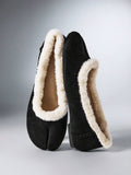 Pair of black smooth split-toe ballet flats with bows