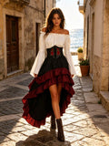 Full outfit view of white blouse, black embroidered waist corset and burgundy-trimmed high-low skirt