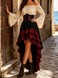 Closer view of white bell-sleeve top, embroidered corset waist and black-burgundy ruffled skirt