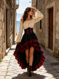 Angled view of white off-shoulder blouse and corset with layered black and burgundy high-low skirt