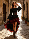 Front view of black off-shoulder dress with corset detail and dramatic black-and-red high-low skirt
