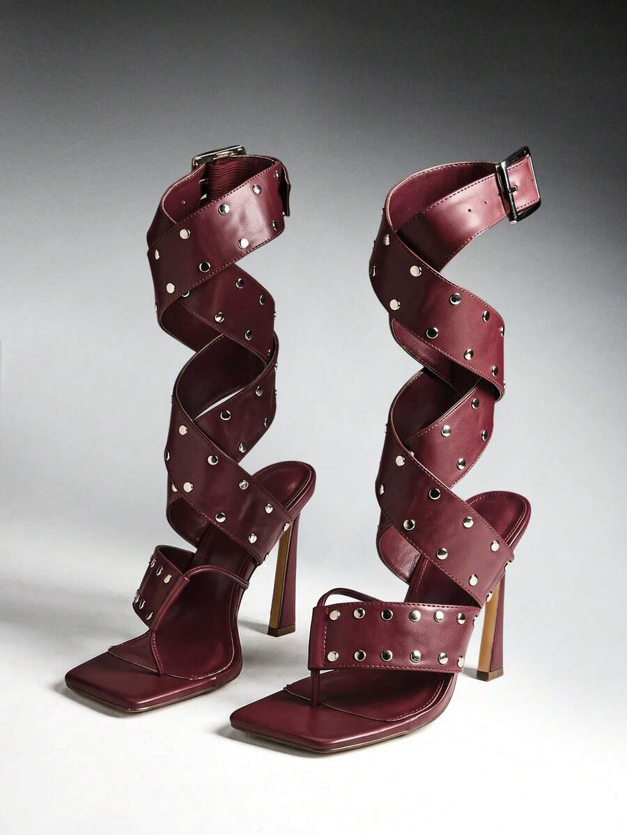 Pair of burgundy studded wraparound high-heel sandals