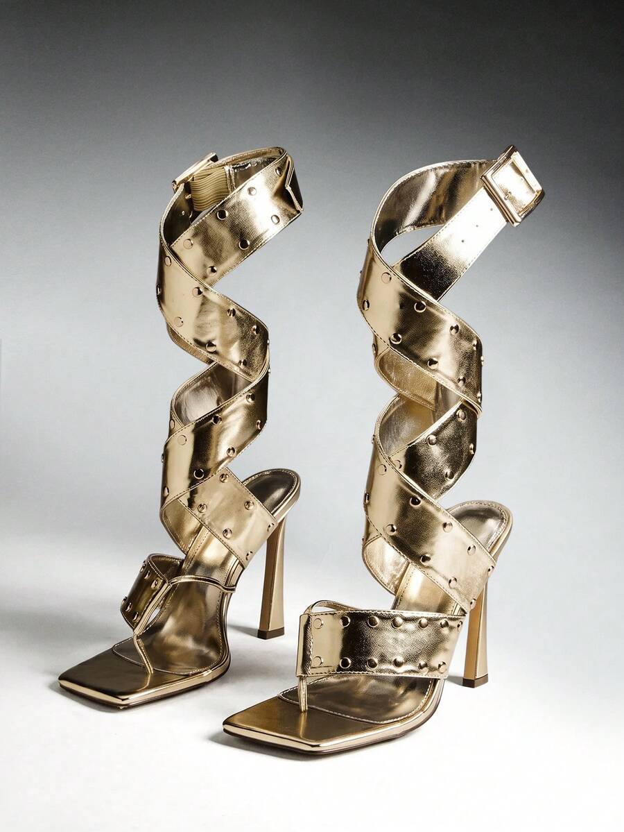 Pair of gold studded wraparound high-heel sandals with square toes