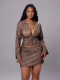 Front view of coffee-brown studded two-piece set with zip-front crop top and mini skirt