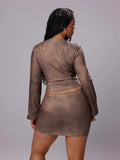 Rear view of coffee-brown long-sleeve crop top and matching mini skirt