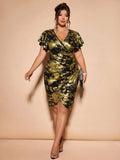 Full-length view of the gold foil bodycon midi dress styled with evening heels