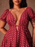 Close-up of red and white polka-dot dress showing deep V neckline and puff sleeves