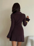 Back view of fitted dark brown rib-knit mini dress with long sleeves and short flared hem