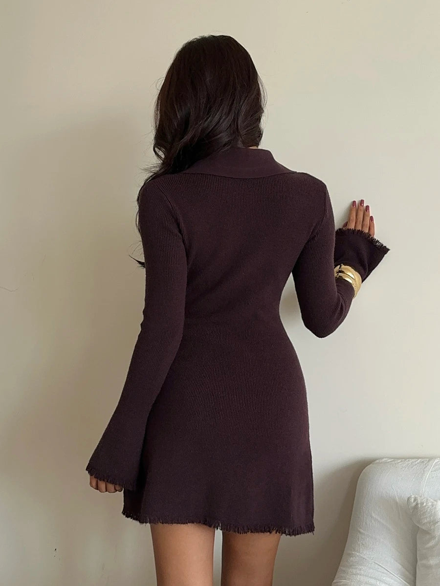Back view of fitted dark brown rib-knit mini dress with long sleeves and short flared hem