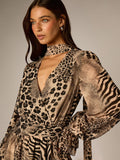 Close-up of choker-style neckline, deep V wrap front, and mixed animal-print bell sleeve
