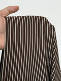 Close-up of brown-and-cream striped knit fabric showing its fine horizontal pattern