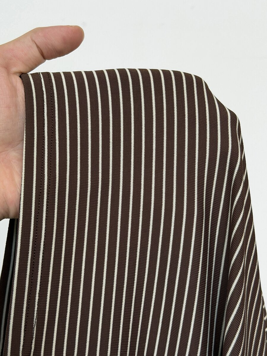 Close-up of brown-and-cream striped knit fabric showing its fine horizontal pattern