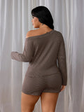 Back view showing the striped knit top and matching mini shorts on a model