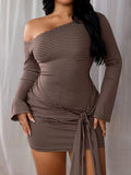 Close-up of the striped dress front showing wrap-style waist tie, gathered draping and asymmetrical shoulder