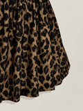 Close-up of gathered flared skirt in brown and black leopard print