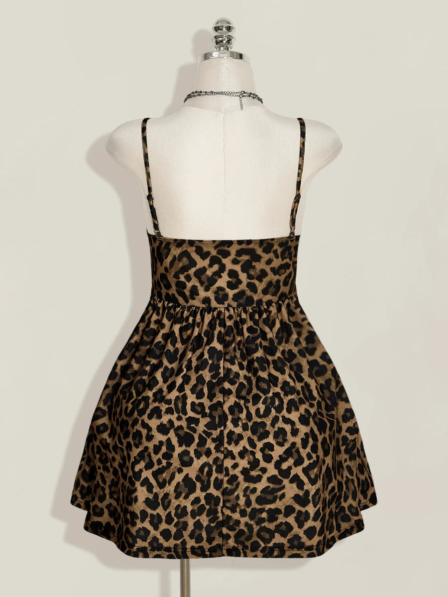 Back view of leopard-print cami dress showing slim straps and gathered flared skirt