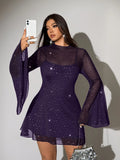 Rear three-quarter view of brown sheer cover-up dress showing layered hem and long sleeves