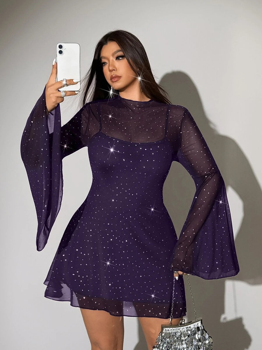 Rear three-quarter view of brown sheer cover-up dress showing layered hem and long sleeves
