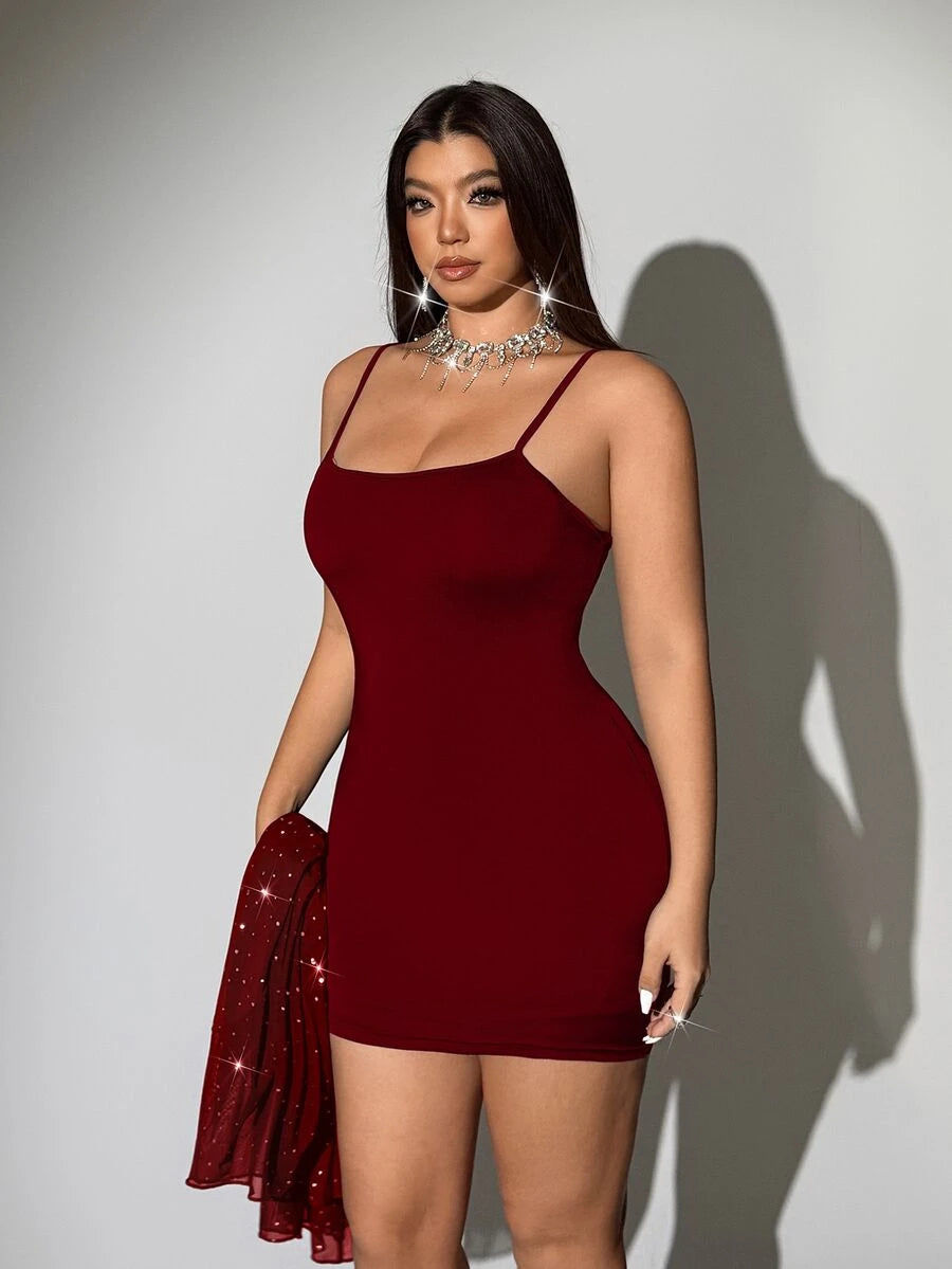 Front view of solid red fitted camisole included beneath the sheer embellished cover-up dress